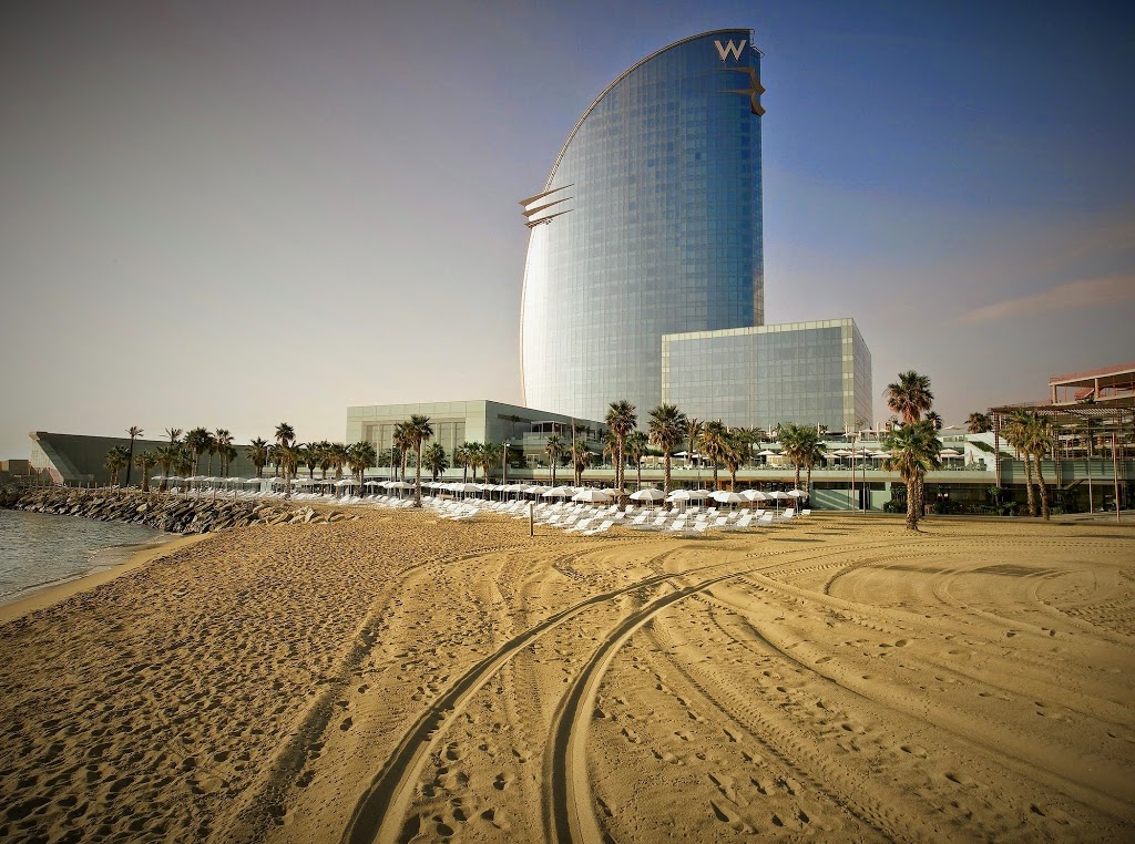 The W Barcelona's silhouette rises up from the sand at Barcelona's Playa Sant Miquel.