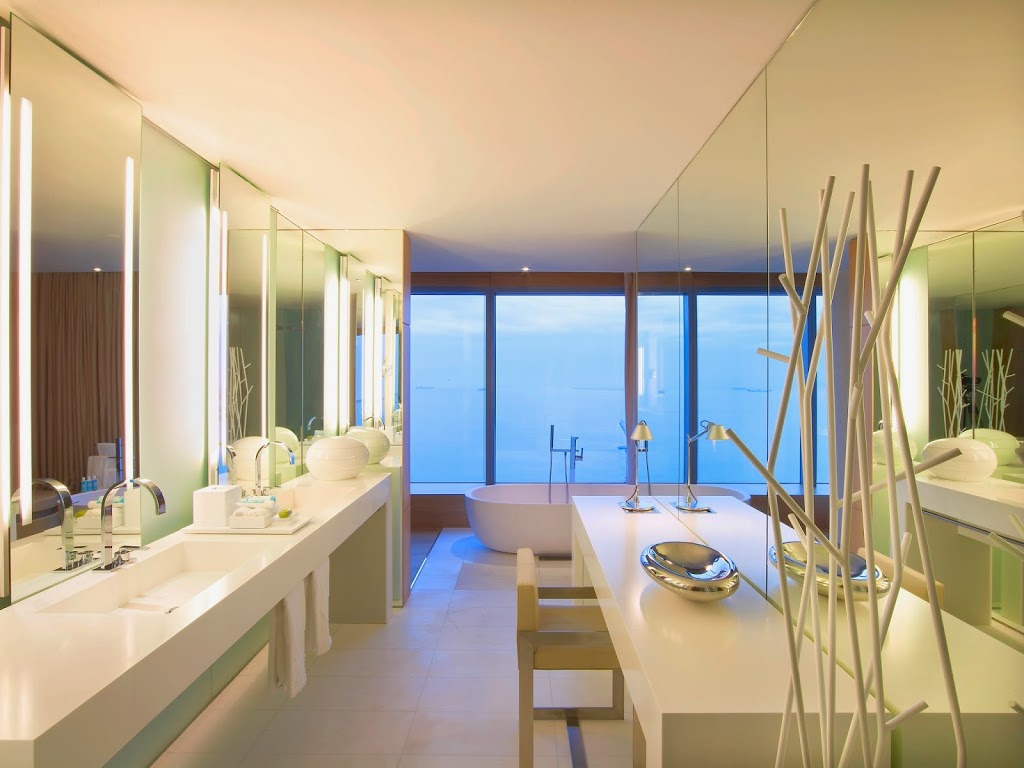 Bliss spa products fill the counters in the deluxe bathroom of the Extreme Wow, one of the W Barcelona's luxury suites.