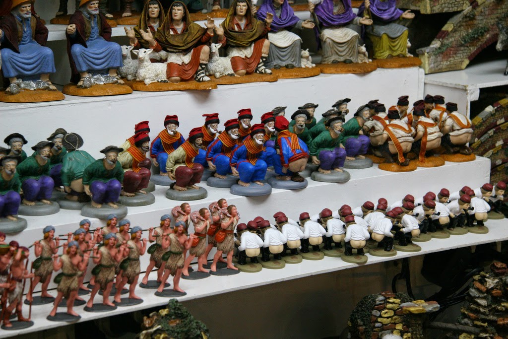 Caganers and other nativity figures at the Barcelona Christmas market.