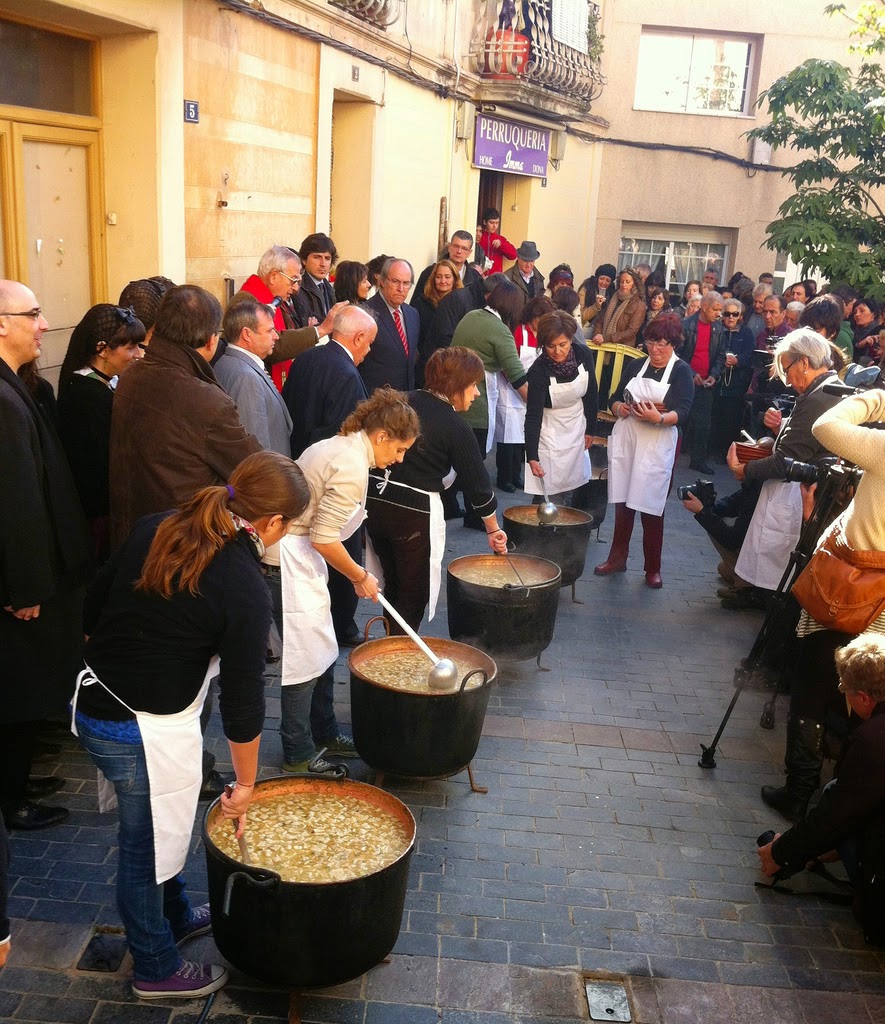 Locals in the Catalan town of Gelida await servings of steaming hot Christmas escudella.